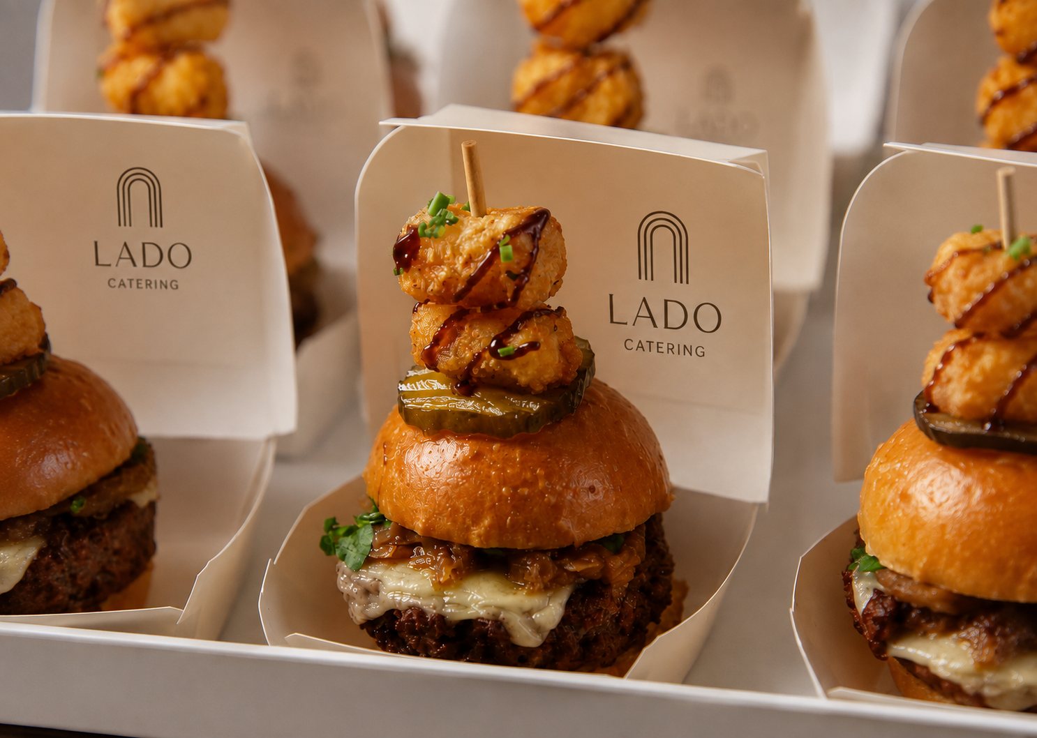 Lado-branded slider skewers plated for a reception